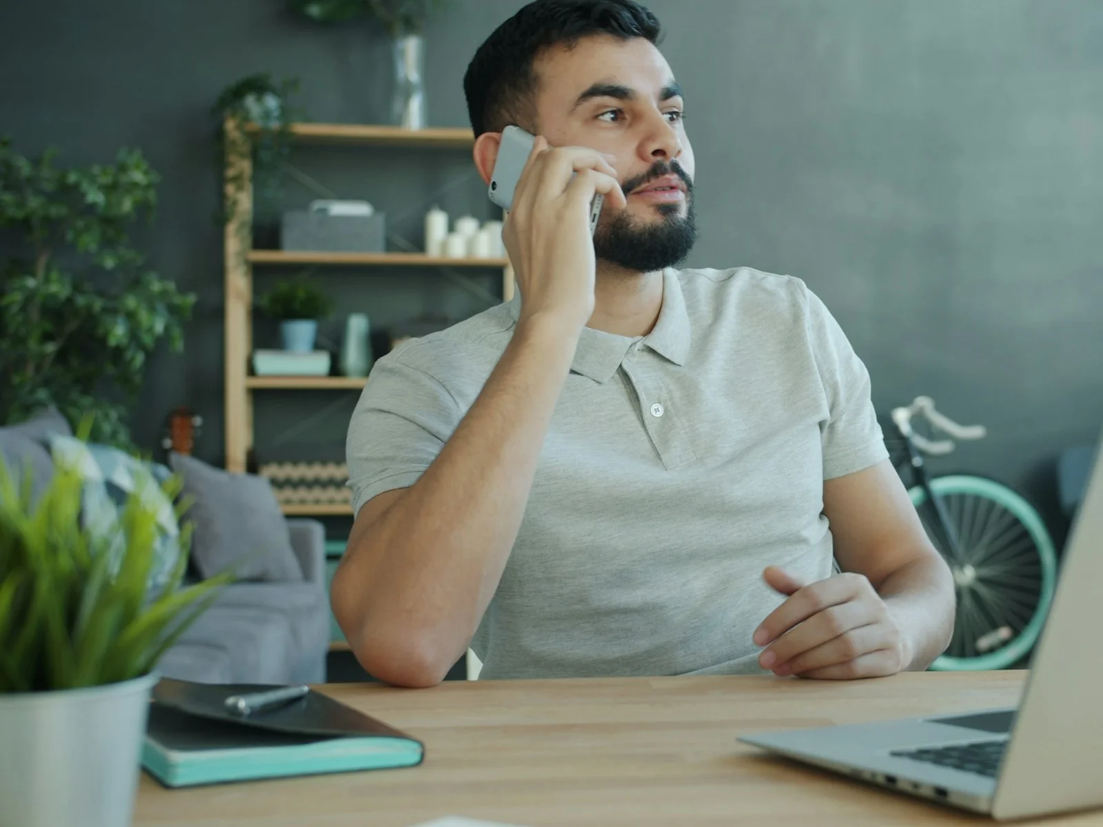 Customer on a business call at a home-office desk